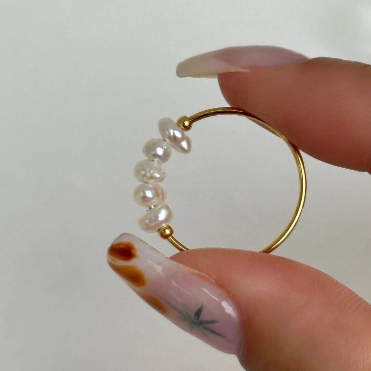 ✨Mini Baroque Pearl Hugger – Size 6✨  Dainty, luminous and made to live in. Five organically shaped freshwater pearls glide along a slim 18 k gold-filled stainless-steel hoop, wrapping the finger with ocean-born iridescence and sun-bright shine. The band