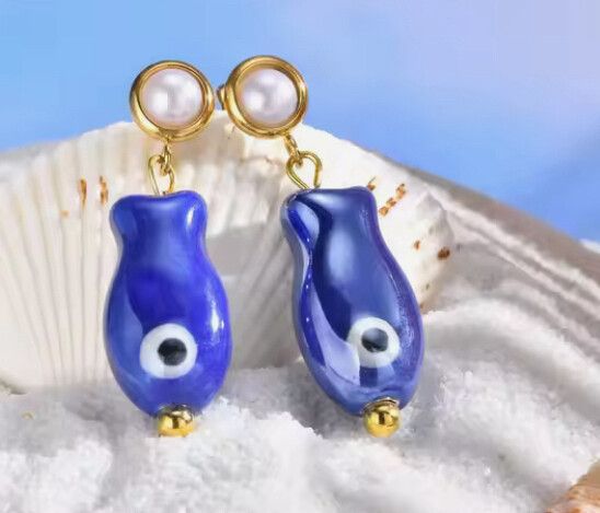✨Evil Eye Fish Drop Earrings✨  Cute, quirky, and powerful — these 3cm drop earrings are crafted from gold-plated brass and finished with deep blue enamel beads in the shape of protective fish-shaped evil eyes. They’re your ultimate ✨statement charm✨ again