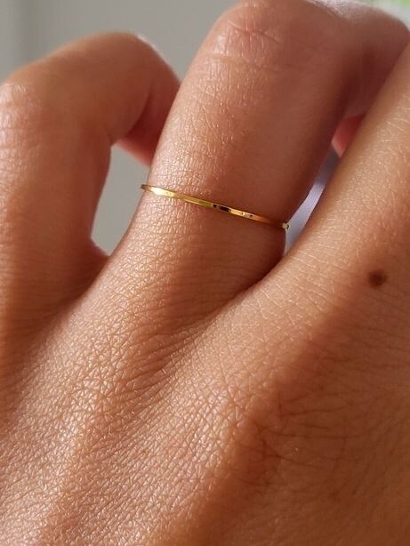 ✨ Minimal Gold Dream Ring ✨  Dainty, elegant, and effortlessly cool — this ultra-thin stacking ring is your everyday essential. Crafted in 18k gold-filled stainless steel, it’s waterproof, tarnish-free, hypoallergenic, and never fades or colors the skin.
