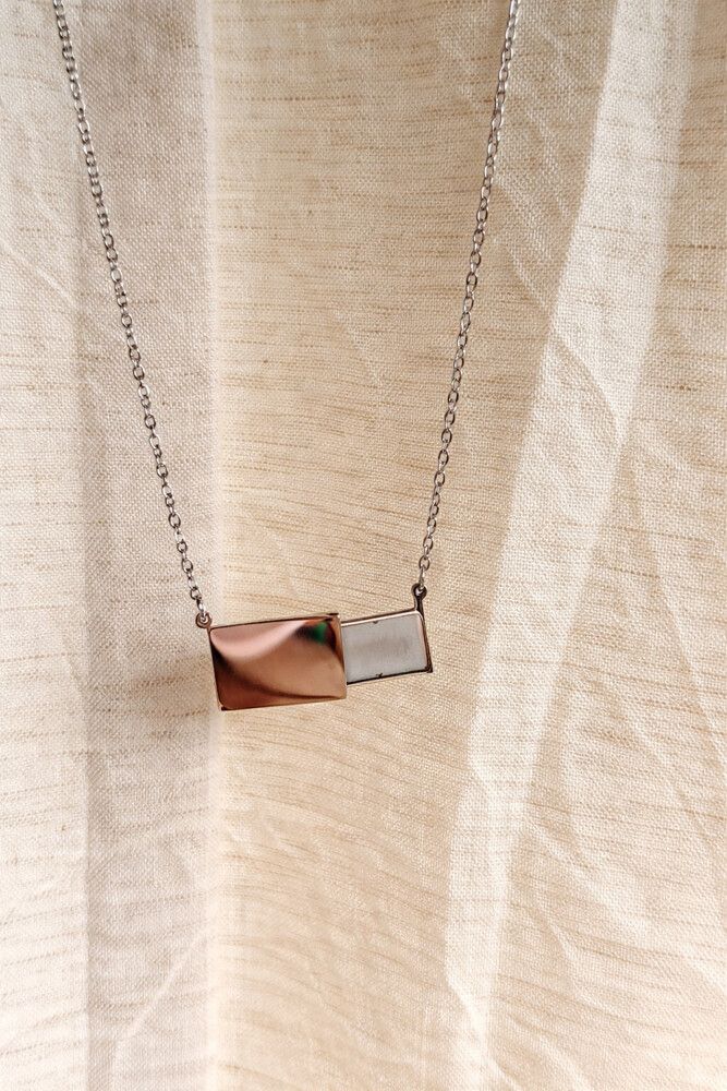 ✨ Secret Slide Pendant Necklace – Hidden Message ✨  A minimalist yet playful piece designed to keep your secrets close. This stainless steel necklace features a sleek rectangular sliding pendant that discreetly moves to the side, revealing a hidden compar