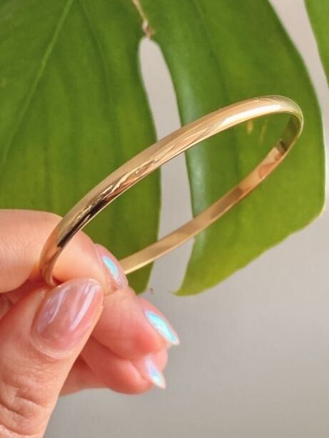 ✨ Oma The Label Gold Bangle ✨  Material: 18K gold-filled stainless steel – waterproof, tarnish-free, hypoallergenic, never fades or colors the skin.  Size: 6 cm diameter (too small for my wrist).  Condition: Brand new, never worn.  Style: The epitome of q