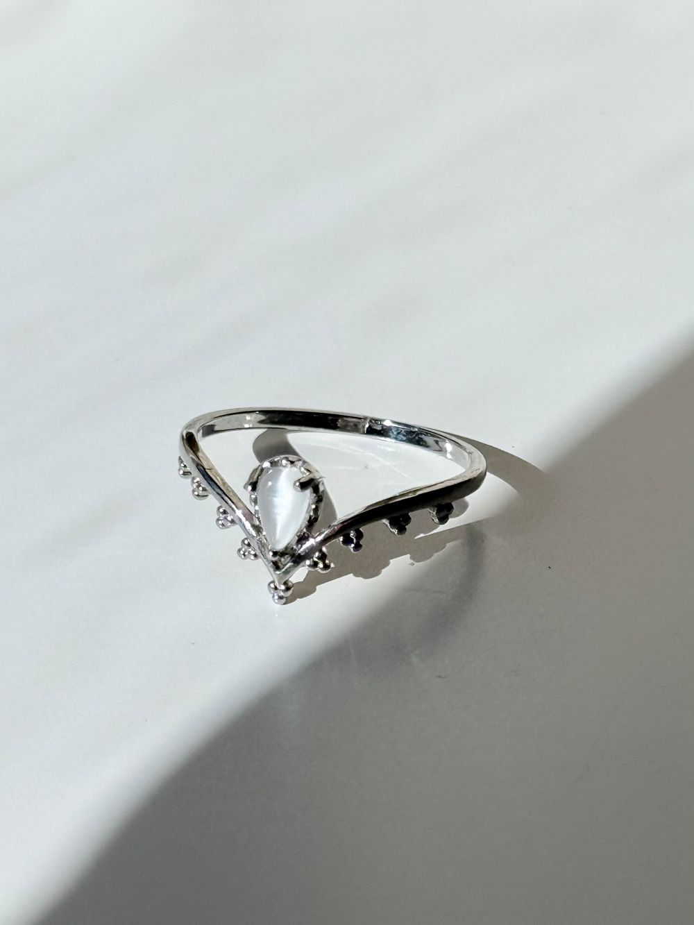 ✨ Silver Witchy Moonstone Ring Size 6 Boho Fairycore Ethnic Statement Ring ✨  Channel your mystical side with this dreamy silver tone ring featuring a glowing faux moonstone opal set in an intricate bohemian design. Delicate bead detailing and the unique 