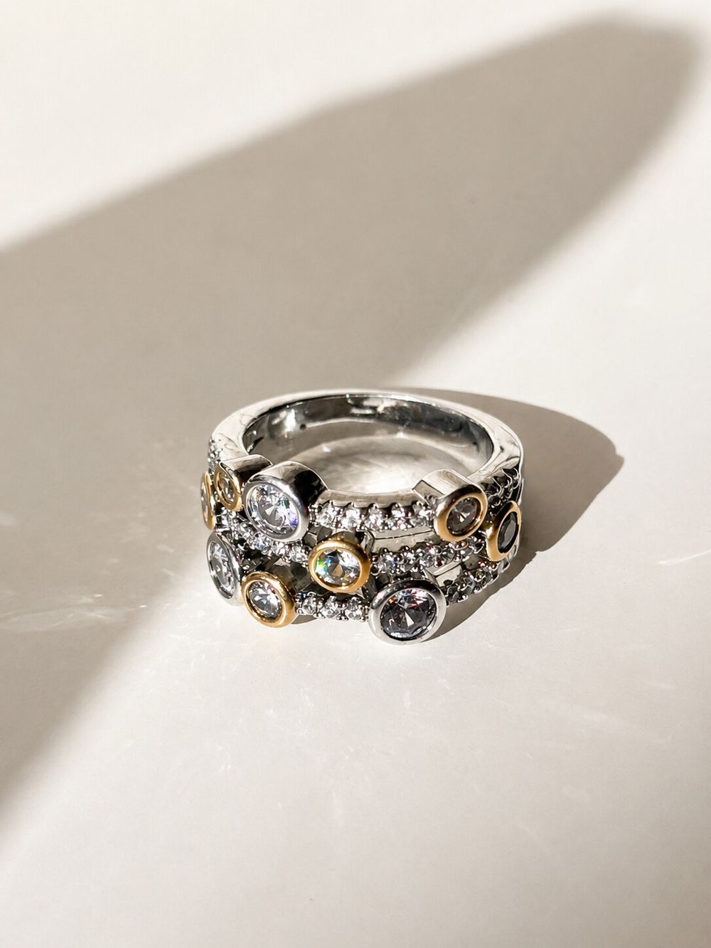 ✨ Silver Bubble Zircon Ring Waterproof Stainless Steel Size 6 ✨  A bold statement ring featuring sparkling bezel set zircons in a modern bubble design. The mix of polished silver tone and gold tone accents gives it an elevated designer-inspired look that 