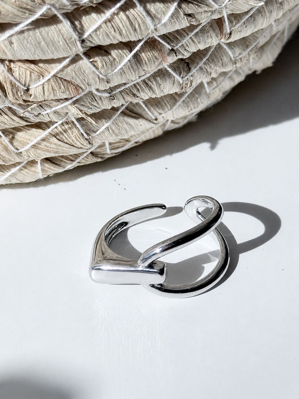 ✨ Genuine Sterling Silver Sculptural Ring Adjustable ✨  A polished sterling silver ring with a fluid open design that wraps softly around the finger. The smooth curved shape feels modern, artistic and easy to style, making it perfect worn alone or paired 