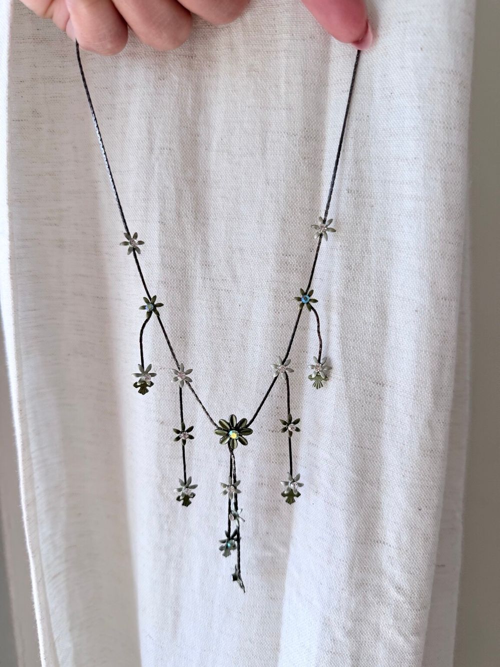 ✨ Authentic Vintage Whimsical Green Flower Necklace ✨  A rare vintage necklace with delicate green metal flowers, tiny sparkling centres and cascading strands that move beautifully when worn. The asymmetrical botanical design feels whimsical, fairy-like a